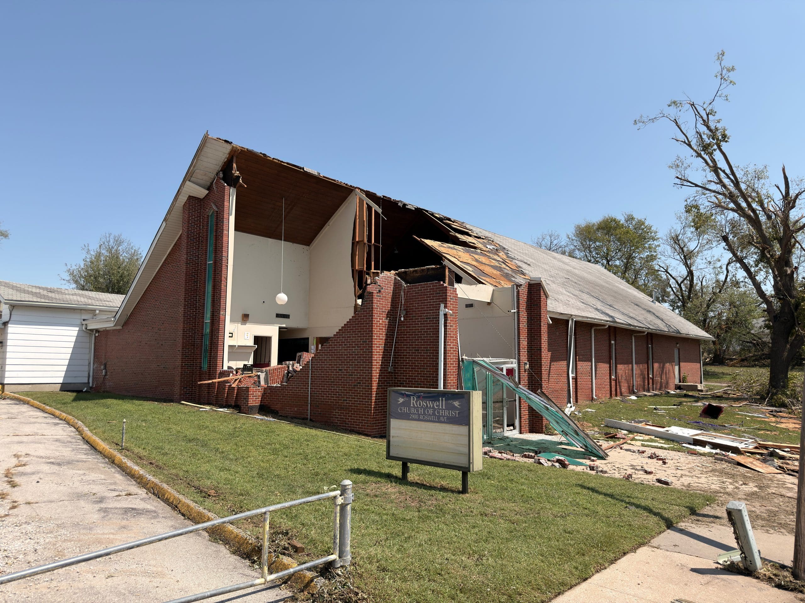 The Roswell Church of Christ in Kansas City, Kansas, its roof and brick wall torn open by the storm