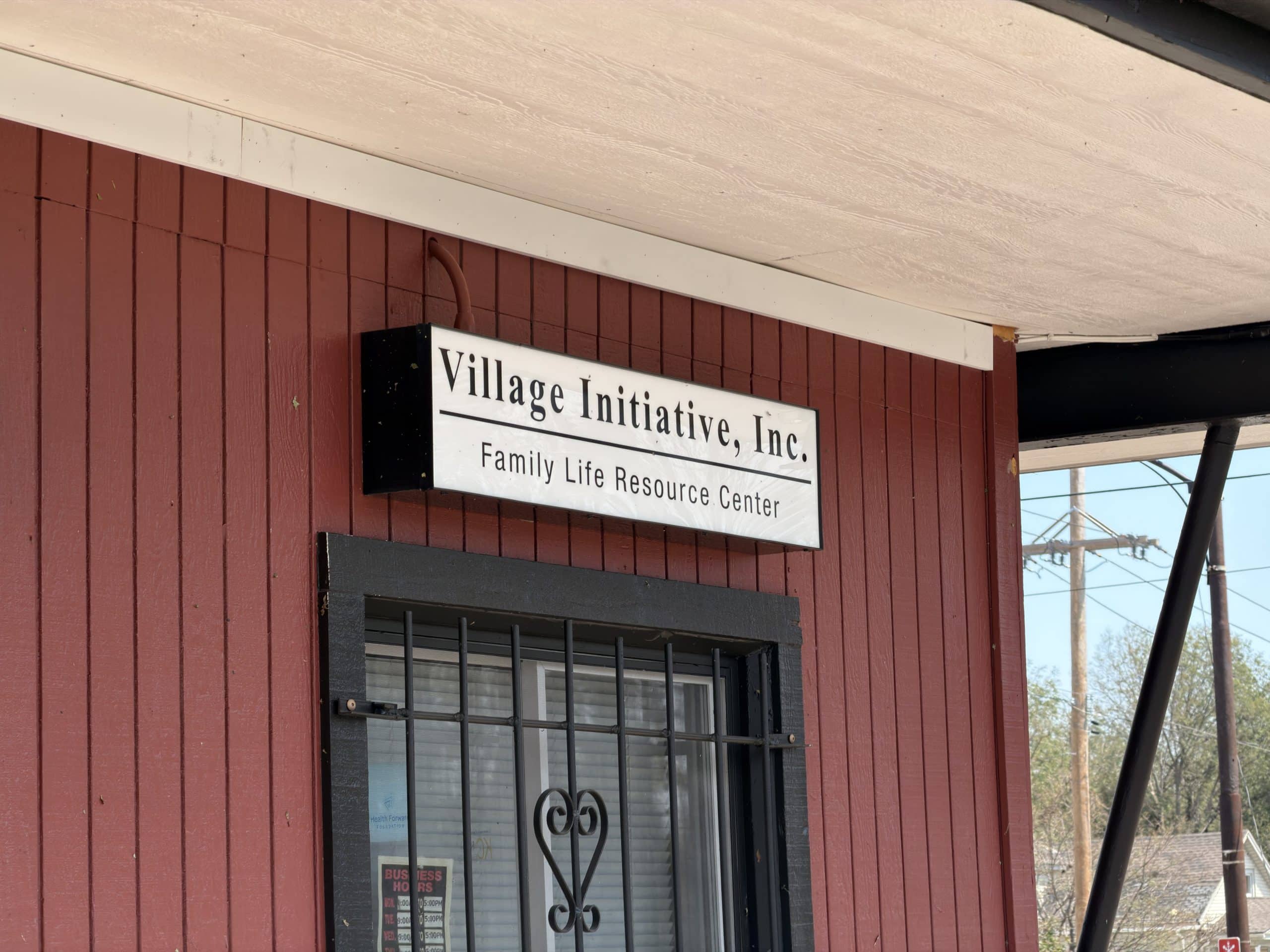 The Village Initiative, Inc. Family Life Resource Center sign on the organization's building
