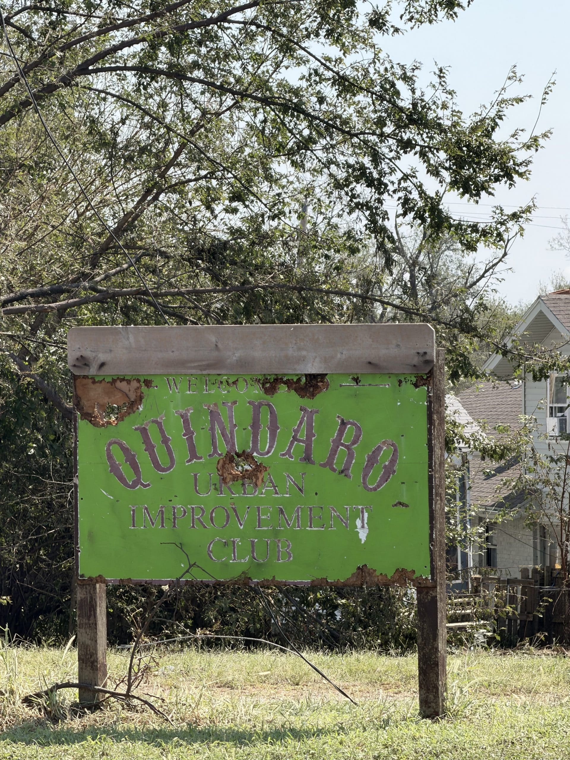 The weathered Quindaro Urban Improvement Club welcome sign